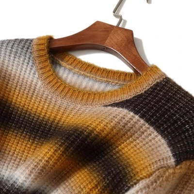 Chunky ribbed texture and ombre stripe detail of custom knit sweater Chunky ribbed texture and ombre stripe detail of custom knit sweater